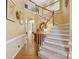 Inviting foyer with a grand staircase, beautiful hardwood floors, and an open layout at 909 Staghorn Ln, Waxhaw, NC 28173