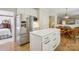 Kitchen with white cabinets, stainless steel appliances, and an eat-in dining area at 909 Staghorn Ln, Waxhaw, NC 28173