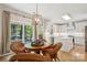 Charming kitchen with stainless steel appliances, white cabinetry, and adjacent breakfast nook at 909 Staghorn Ln, Waxhaw, NC 28173