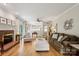 Spacious living room with fireplace, hardwood floors, and ample natural light and comfortable seating at 909 Staghorn Ln, Waxhaw, NC 28173