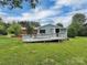A home exterior showcases a wooden deck and ramp, perfect for enjoying outdoor living at 104 Tobe Bridge Rd, Kings Mountain, NC 28086