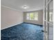 Bedroom featuring a ceiling fan, large window, and blue carpeting at 104 Tobe Bridge Rd, Kings Mountain, NC 28086