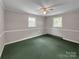 Cozy bedroom featuring a ceiling fan, two windows, and green carpeting at 104 Tobe Bridge Rd, Kings Mountain, NC 28086