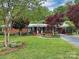 Lovely brick home featuring a well-manicured lawn, mature trees, and a welcoming entrance at 104 Tobe Bridge Rd, Kings Mountain, NC 28086