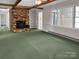 Cozy living room featuring a brick fireplace and exposed wood beams at 104 Tobe Bridge Rd, Kings Mountain, NC 28086