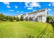 Large backyard featuring green grass and black iron fencing at 10693 Sky Chase Nw Ave, Concord, NC 28027