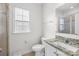 Bathroom with granite vanity top, tiled floors and walk-in shower at 10693 Sky Chase Nw Ave, Concord, NC 28027