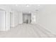 Open bonus room with neutral carpet and abundant natural light offers versatility and comfortable living space at 10693 Sky Chase Nw Ave, Concord, NC 28027