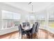 Inviting dining area with large windows offering natural light and a view of the outdoors at 10693 Sky Chase Nw Ave, Concord, NC 28027