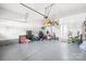 Spacious garage featuring overhead storage and ample room for parking and hobbies at 10693 Sky Chase Nw Ave, Concord, NC 28027