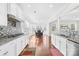 Bright kitchen featuring stainless appliances, granite counters and an open layout to the dining area at 10693 Sky Chase Nw Ave, Concord, NC 28027