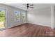 Serene bedroom featuring wood-look flooring, bright windows, and a ceiling fan at 109 Jackson St, Salisbury, NC 28144