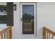 Inviting front entrance with glass storm door, adjacent window, and sleek outdoor lighting at 109 Jackson St, Salisbury, NC 28144