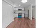 Bright kitchen features stainless steel appliances, white cabinets, and wood-look flooring at 109 Jackson St, Salisbury, NC 28144