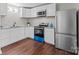 Open kitchen with new stainless steel appliances and white cabinets at 109 Jackson St, Salisbury, NC 28144