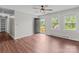 Open floor plan with wood-look flooring, large windows, and access to the exterior at 109 Jackson St, Salisbury, NC 28144