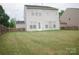 Expansive backyard featuring a well-maintained lawn and privacy fence, perfect for outdoor activities and relaxation at 10901 Claude Freeman Dr, Charlotte, NC 28262