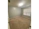 Bedroom featuring neutral carpet, a window, and a ceiling light at 10901 Claude Freeman Dr, Charlotte, NC 28262