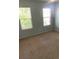Bedroom with carpet and two windows at 10901 Claude Freeman Dr, Charlotte, NC 28262