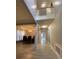 Elegant dining room with hardwood floors, a chandelier, and a view of the second-floor landing at 10901 Claude Freeman Dr, Charlotte, NC 28262
