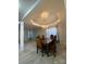 Elegant dining room with a large wooden table, a chandelier, and a view of the outside at 10901 Claude Freeman Dr, Charlotte, NC 28262