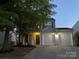 Charming two-story home with a two-car garage, inviting front porch, and manicured lawn at 10901 Claude Freeman Dr, Charlotte, NC 28262