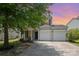 Charming two-story home boasts a well-manicured lawn and two-car garage at 10901 Claude Freeman Dr, Charlotte, NC 28262
