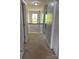 Upstairs hallway with a view of the chandelier and stairway at 10901 Claude Freeman Dr, Charlotte, NC 28262