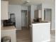 A kitchen with stainless steel appliances, light countertops, and neutral cabinets at 10901 Claude Freeman Dr, Charlotte, NC 28262