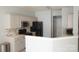 An open kitchen with stainless steel appliances, light countertops, and neutral cabinets at 10901 Claude Freeman Dr, Charlotte, NC 28262