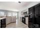 Well-equipped kitchen features stylish backsplash, modern appliances, and ample counter space at 10901 Claude Freeman Dr, Charlotte, NC 28262