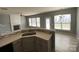 Open-concept kitchen with modern countertops, stainless steel sink, and natural light at 10901 Claude Freeman Dr, Charlotte, NC 28262