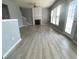 Spacious living room featuring wood floors, natural light, and a fireplace at 10901 Claude Freeman Dr, Charlotte, NC 28262