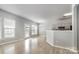 Open-concept space showcases laminate flooring and seamless transition to the kitchen at 10901 Claude Freeman Dr, Charlotte, NC 28262