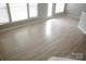 Bright living room with lots of natural light and laminate floors at 10901 Claude Freeman Dr, Charlotte, NC 28262