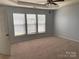 Spacious main bedroom with three windows that provide natural lighting at 10901 Claude Freeman Dr, Charlotte, NC 28262