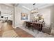 Inviting dining room with modern chandelier, stylish table setting, and neutral decor at 1099 Sugar Creek Rd, Indian Land, SC 29707