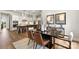Open-concept dining area with modern furniture, stylish decor, and views of the gourmet kitchen at 1099 Sugar Creek Rd, Indian Land, SC 29707