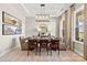 Elegant dining room with a tray ceiling, sophisticated decor, and a view of the outdoors at 1099 Sugar Creek Rd, Indian Land, SC 29707