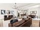 Open-concept living area with hardwood floors, comfortable seating, and seamless kitchen access at 1099 Sugar Creek Rd, Indian Land, SC 29707