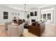 Spacious living room with hardwood floors, modern fireplace, and comfortable leather seating at 1099 Sugar Creek Rd, Indian Land, SC 29707