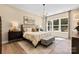 Cozy primary bedroom with a large window, stylish furniture, and decorative lighting at 1099 Sugar Creek Rd, Indian Land, SC 29707