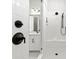 Modern tiled shower featuring matte black fixtures and a built-in bench at 1099 Sugar Creek Rd, Indian Land, SC 29707