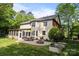 Spacious backyard with a patio, outdoor seating, a grill, and lush green lawn at 1108 Longwood Ct, Matthews, NC 28104