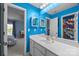 Bathroom with bright blue walls, modern vanity, sink and vanity at 1108 Longwood Ct, Matthews, NC 28104