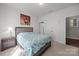 Bedroom with a comfortable bed, bedside table, and neutral decor at 1108 Longwood Ct, Matthews, NC 28104