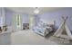 Bedroom with large windows, ample natural light, and carpet flooring at 1108 Longwood Ct, Matthews, NC 28104