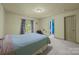Bedroom featuring neutral walls, carpet, and a window with patterned curtains at 1108 Longwood Ct, Matthews, NC 28104