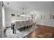 Spacious dining room with hardwood floors, a modern light fixture, and a cozy ambiance for Gathering meals at 1108 Longwood Ct, Matthews, NC 28104