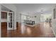 Elegant dining room featuring hardwood floors, a modern chandelier, and a spacious layout for Gathering gatherings at 1108 Longwood Ct, Matthews, NC 28104